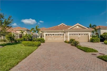 Gorgeous 2 bedroom villa sits lakefront in the resort-style community of Watermark in sunny Fort Myers, FL. property image