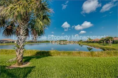 Gorgeous 2 bedroom villa sits lakefront in the resort-style community of Watermark in sunny Fort Myers, FL. property image