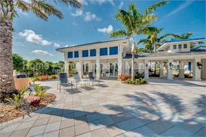 Gorgeous 2 bedroom villa sits lakefront in the resort-style community of Watermark in sunny Fort Myers, FL. property image