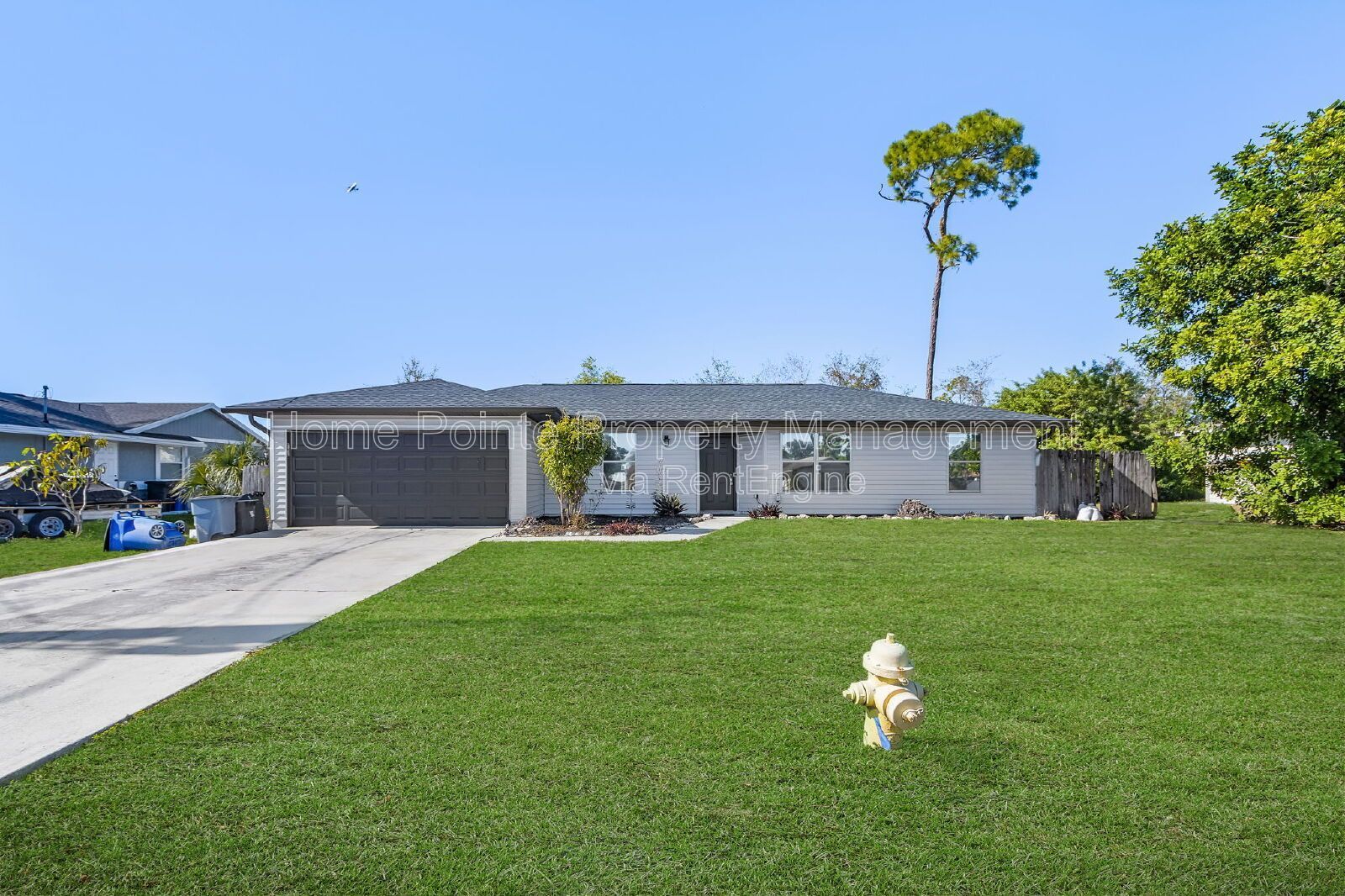 Charming 4BR Home with Garage, Lanai & Serene Waterfront Setting property image