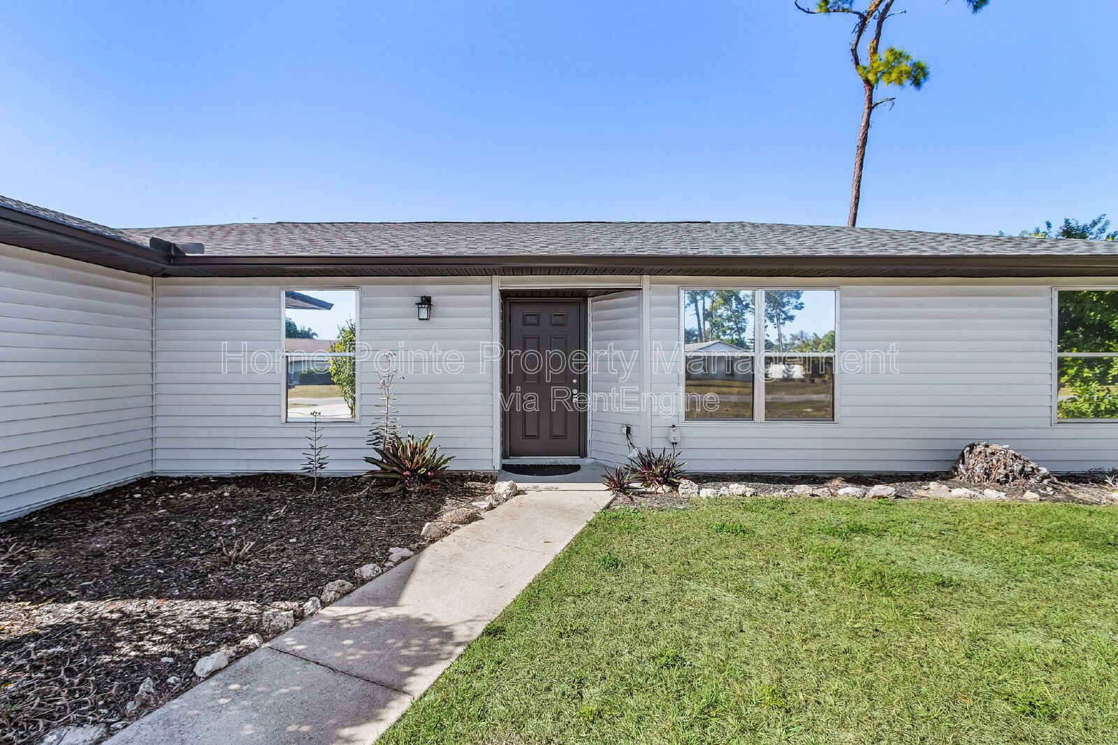 Charming 4BR Home with Garage, Lanai & Serene Waterfront Setting property image