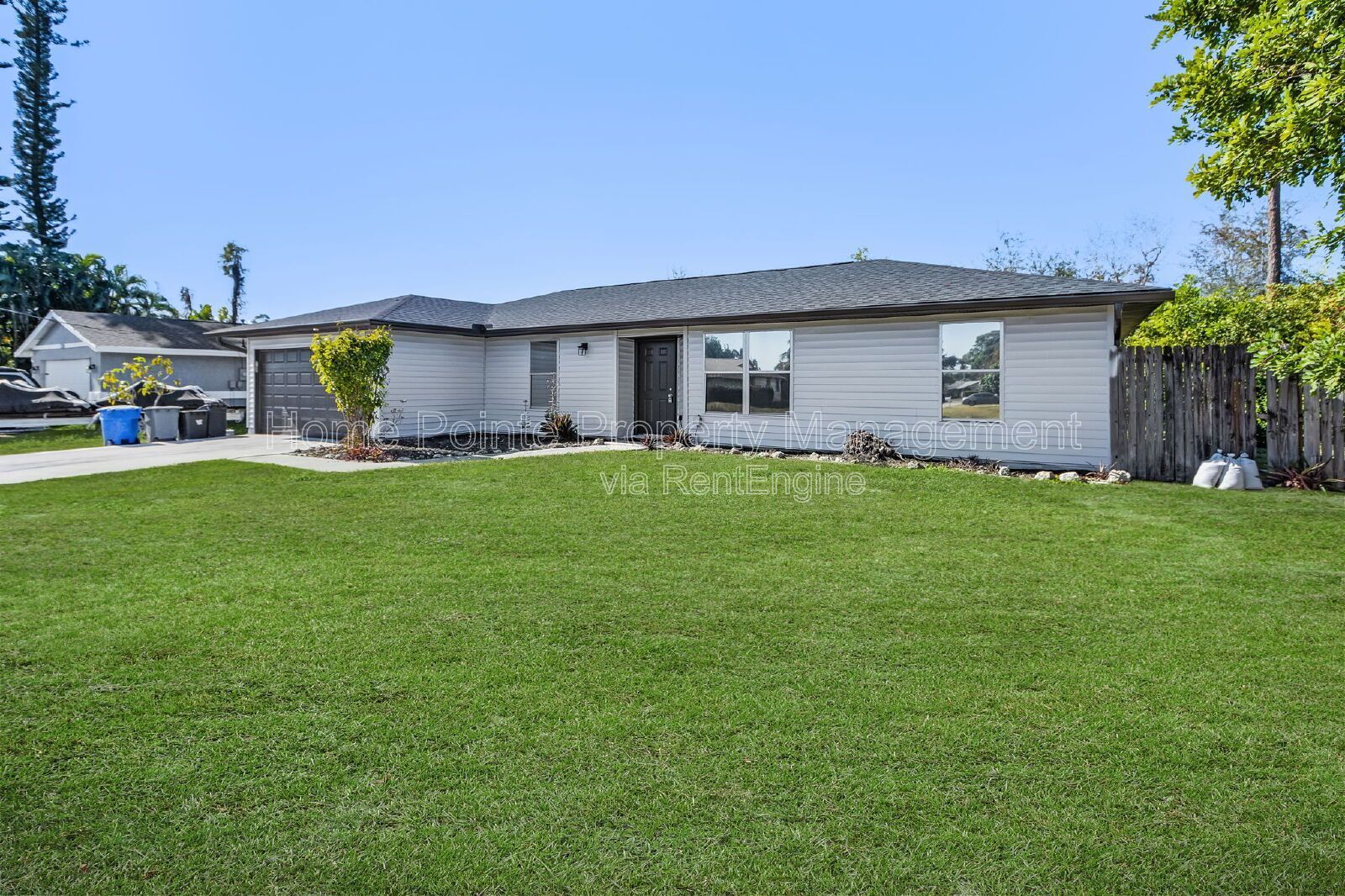 Charming 4BR Home with Garage, Lanai & Serene Waterfront Setting property image